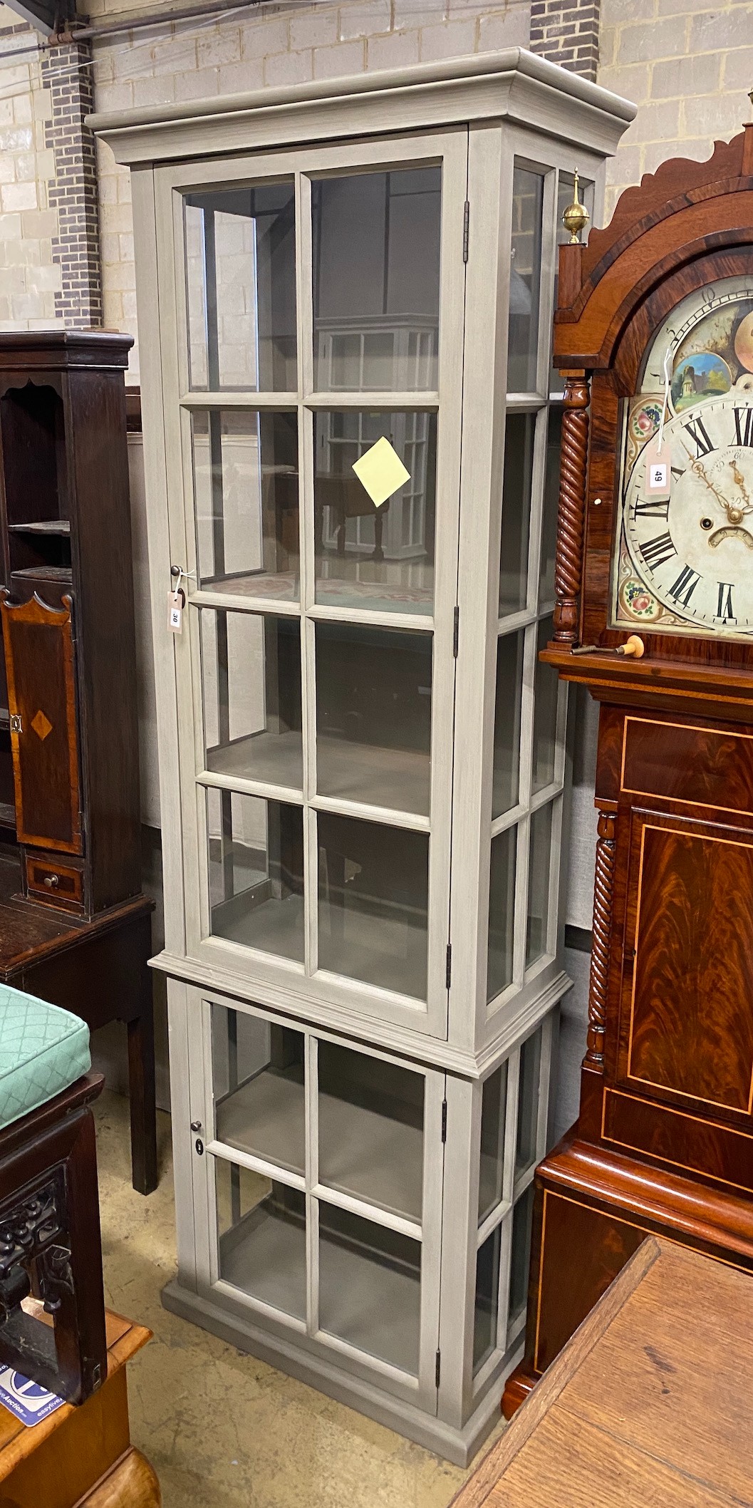 An eau de nil painted display cabinet, width 73cm, depth 39cm, height 230cm